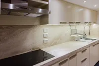 Modern kitchen with sleek cabinets, marble countertop, and stainless steel appliances, Custom Canyon 92, 2024.