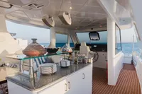 Luxurious 2024 Custom Canyon 92 yacht interior with modern kitchen and ocean view.
