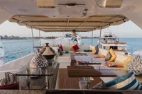 Luxurious 2024 Custom Canyon 92 yacht with elegant seating and ocean view.