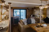 Luxurious interior of 2024 Custom Canyon 92 yacht with elegant furnishings and sea view.