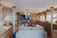 Luxurious interior of 2024 Custom Canyon 92 yacht with modern decor and comfortable seating.