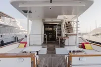 Luxurious 2024 Custom Canyon 92 yacht deck with seating and staircase.