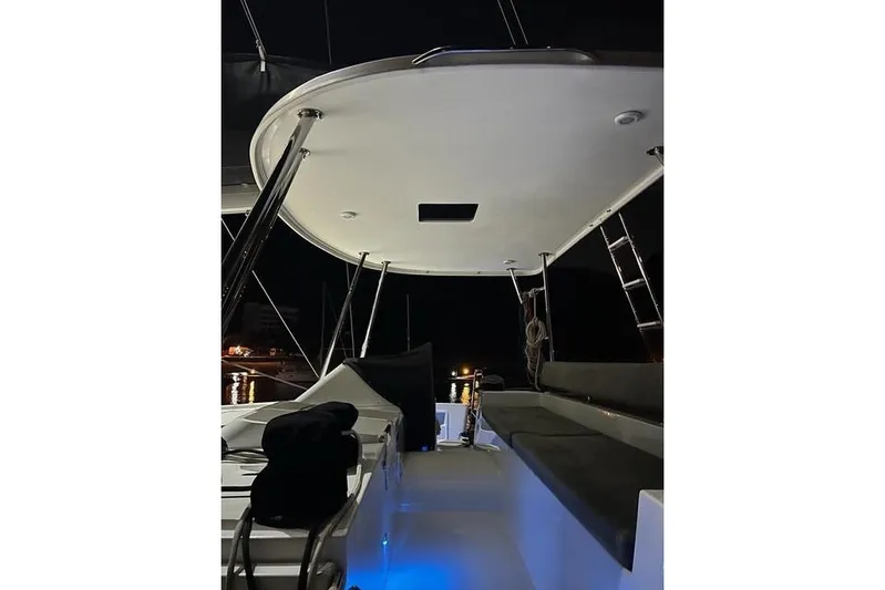  Yacht Photos Pics 2018 Lagoon 450 F catamaran deck at night, featuring seating and ambient lighting.