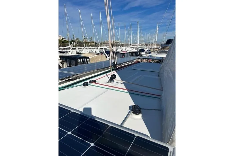  Yacht Photos Pics 2018 Lagoon 450 F catamaran with solar panels docked at marina.