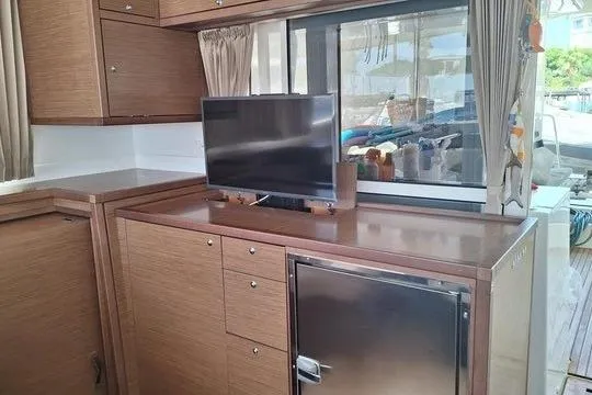  Yacht Photos Pics Interior of 2018 Lagoon 450 F yacht with TV and compact fridge.