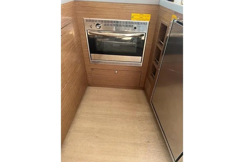  Yacht Photos Pics Modern kitchen area in 2018 Lagoon 450 F yacht with stainless steel oven.