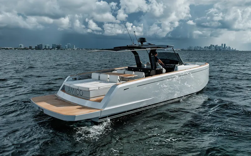  Yacht Photos Pics 2022 Pardo Yachts 43 cruising on ocean with city skyline in background.