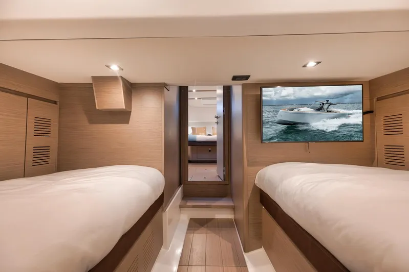  Yacht Photos Pics Interior of 2022 Pardo Yachts 43, featuring twin beds and a wall-mounted TV.