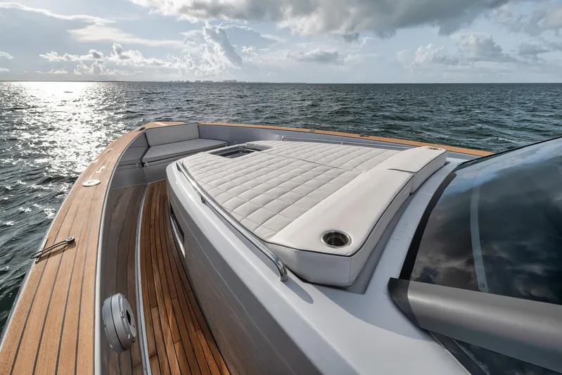  Yacht Photos Pics Luxurious 2022 Pardo Yachts 43 with sunbed, cruising on open sea under cloudy sky.