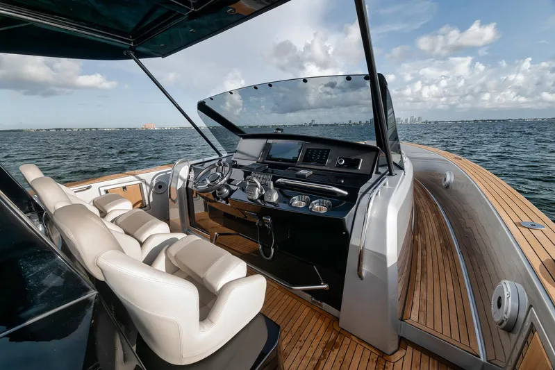  Yacht Photos Pics Luxurious 2022 Pardo Yachts 43 helm with leather seats and modern controls on open water.
