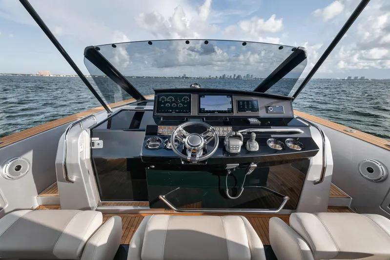  Yacht Photos Pics Cockpit view of 2022 Pardo Yachts 43, featuring modern controls and ocean backdrop.