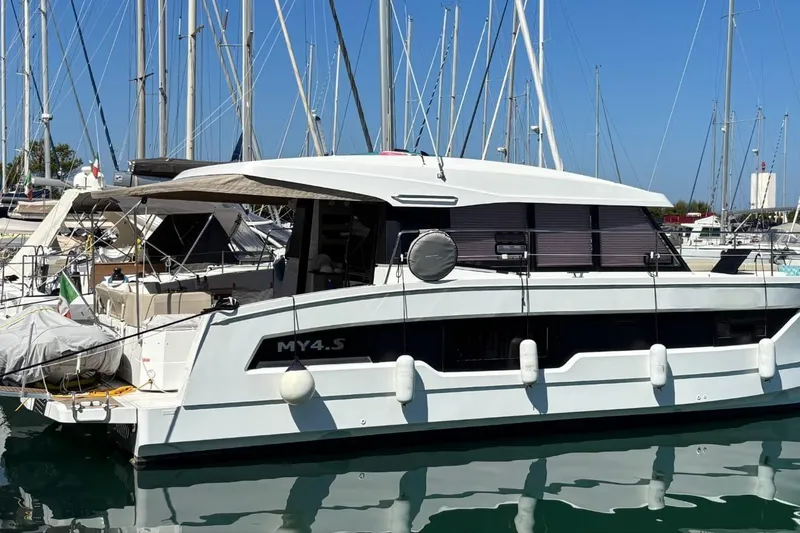  Yacht Photos Pics 2025 Fountaine Pajot MY4.S yacht docked in a marina, side view.