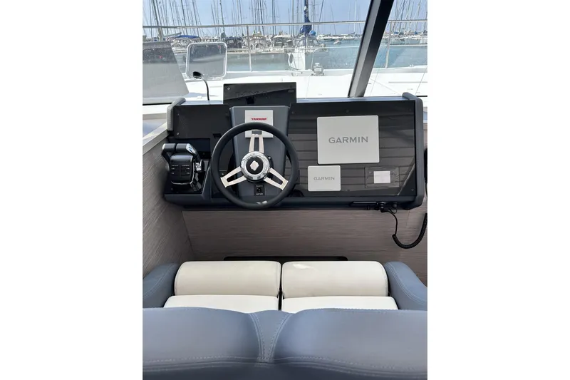  Yacht Photos Pics 2025 Fountaine Pajot MY4.S helm with Garmin navigation system and Yanmar controls.