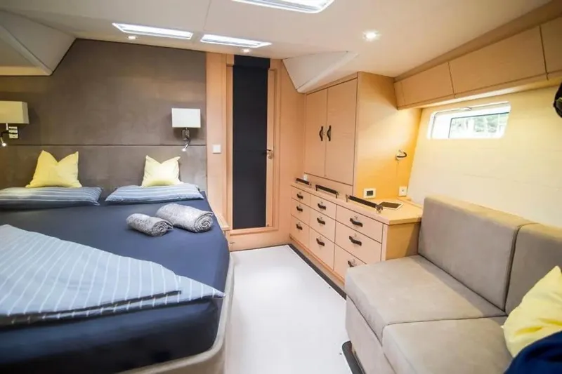  Yacht Photos Pics Luxurious interior of 2016 Jeanneau 64 yacht with cozy bedroom and modern furnishings.