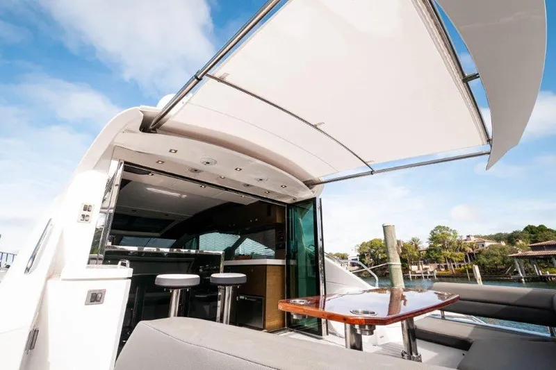 Charlotte Yacht Photos Pics 2019 Cruisers Yachts 60 Cantius luxury yacht with open deck and seating area.