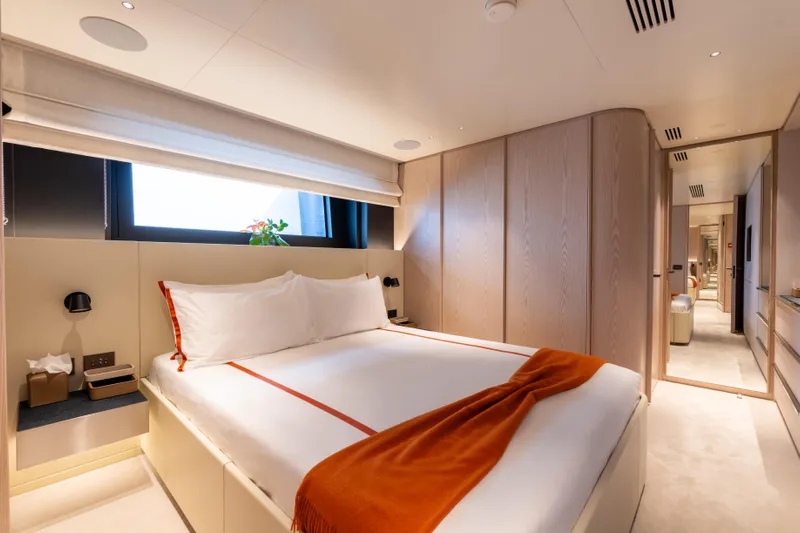 A+ Yacht Photos Pics Luxurious bedroom interior of 2024 Benetti Oasis yacht, featuring modern design and cozy ambiance.
