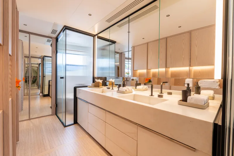 A+ Yacht Photos Pics Luxurious bathroom in 2024 Benetti Oasis yacht, featuring modern design and elegant fixtures.