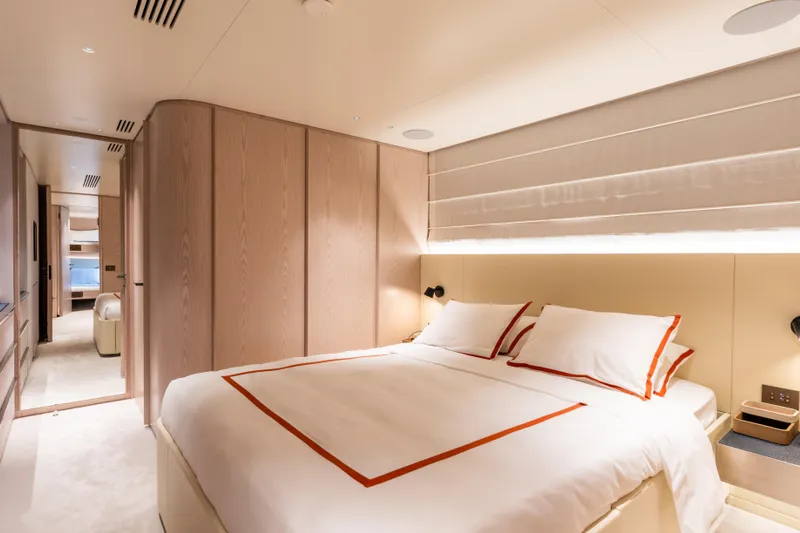 A+ Yacht Photos Pics Luxurious bedroom interior of 2024 Benetti Oasis yacht with elegant design and modern amenities.