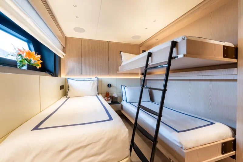 A+ Yacht Photos Pics 2024 Benetti Oasis yacht cabin with bunk beds, modern design, and elegant decor.
