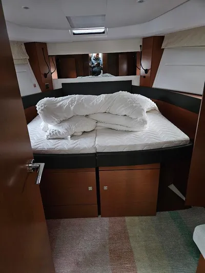 Yacht Photos Pics Interior of 2017 Jeanneau NC14 yacht with cozy bed and modern design.