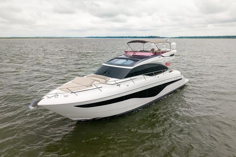 Regent Yacht Photos Pics Luxurious 2021 Princess S62 yacht cruising on open water under cloudy skies.