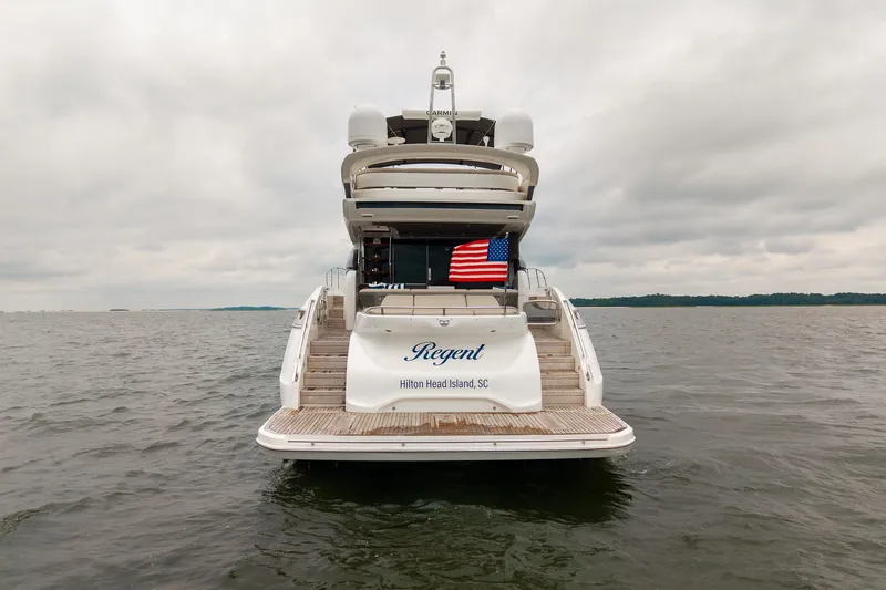 Regent Yacht Photos Pics 2021 Princess S62 yacht on water, rear view, American flag, Hilton Head Island, SC.