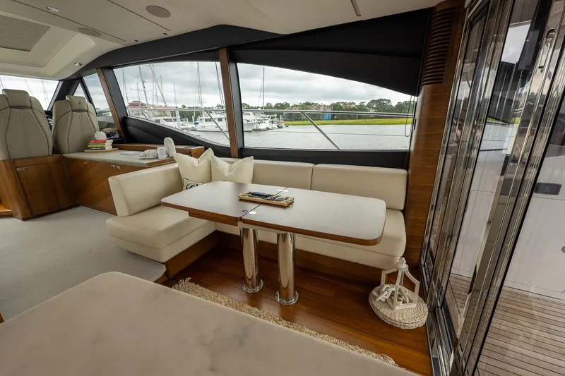 Regent Yacht Photos Pics Luxurious interior of 2021 Princess S62 yacht with elegant seating and scenic window views.
