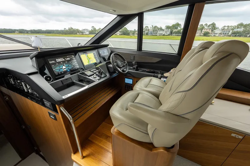 Regent Yacht Photos Pics Luxurious 2021 Princess S62 yacht cockpit with advanced navigation systems and plush seating.