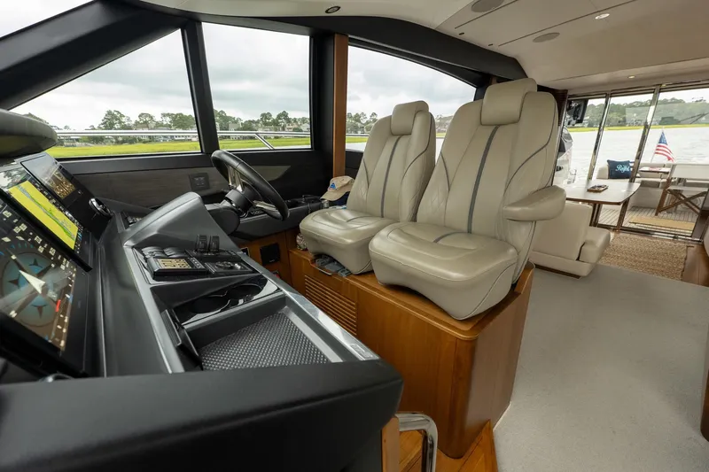Regent Yacht Photos Pics Luxurious 2021 Princess S62 yacht helm with leather seats and advanced navigation controls.