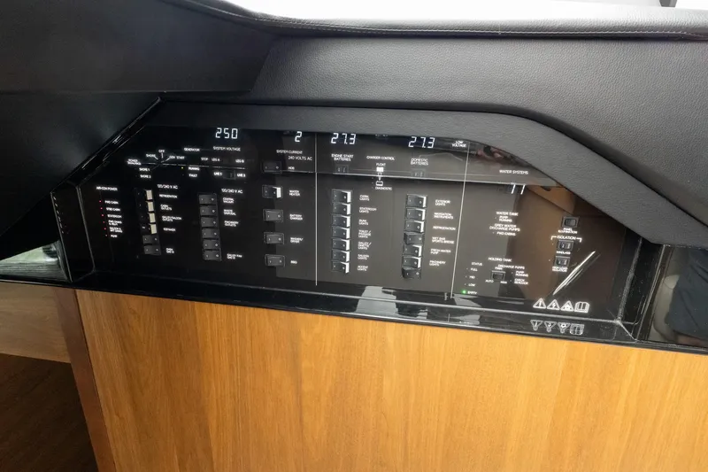 Regent Yacht Photos Pics Control panel of a 2021 Princess S62 yacht, featuring various system indicators and switches.