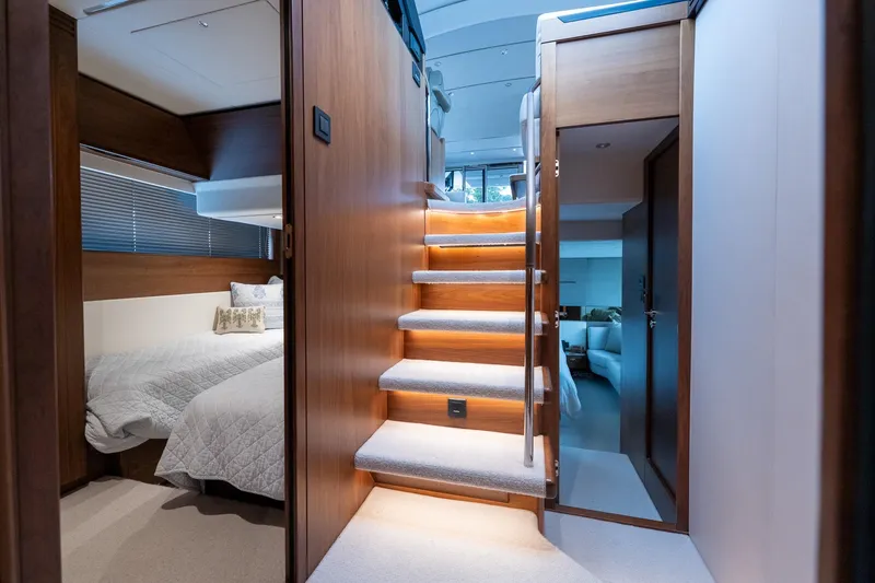 Regent Yacht Photos Pics Interior of 2021 Princess S62 yacht featuring stairs, bedroom, and modern design.