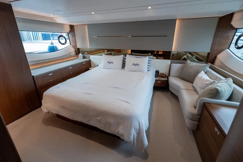 Regent Yacht Photos Pics Luxurious bedroom interior of 2021 Princess S62 yacht with elegant furnishings and natural light.