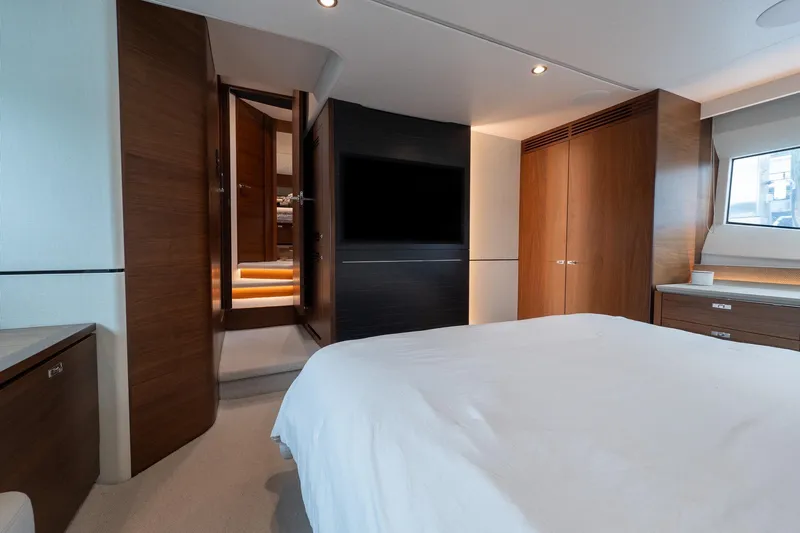 Regent Yacht Photos Pics Luxurious 2021 Princess S62 yacht bedroom with modern wood finishes and ambient lighting.