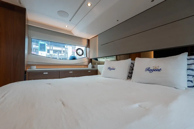 Regent Yacht Photos Pics Luxurious bedroom interior of 2021 Princess S62 yacht with elegant bedding and modern design.
