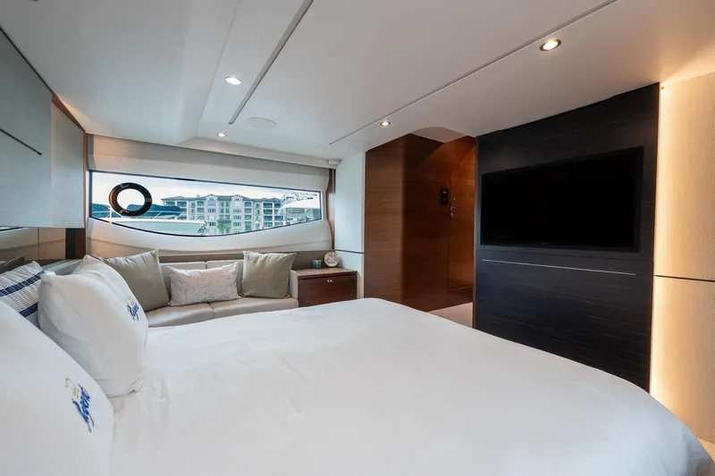 Regent Yacht Photos Pics Luxurious bedroom interior of 2021 Princess S62 yacht with modern design and large window view.
