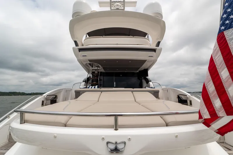 Regent Yacht Photos Pics Luxury 2021 Princess S62 yacht with American flag, featuring spacious deck and modern design.