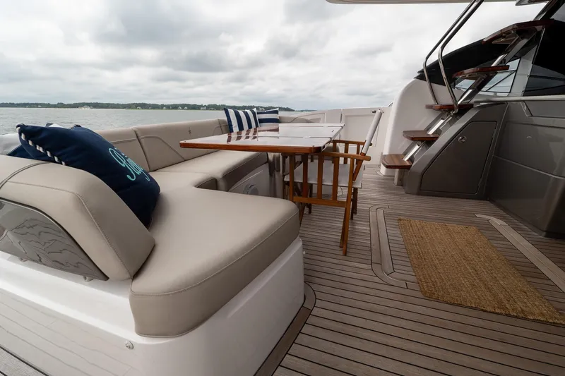 Regent Yacht Photos Pics Luxurious 2021 Princess S62 yacht deck with seating, table, and stairs.