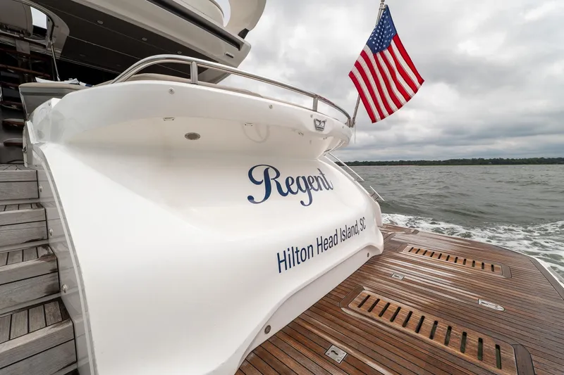 Regent Yacht Photos Pics 2021 Princess S62 yacht with American flag, named "Regent," Hilton Head Island, SC.