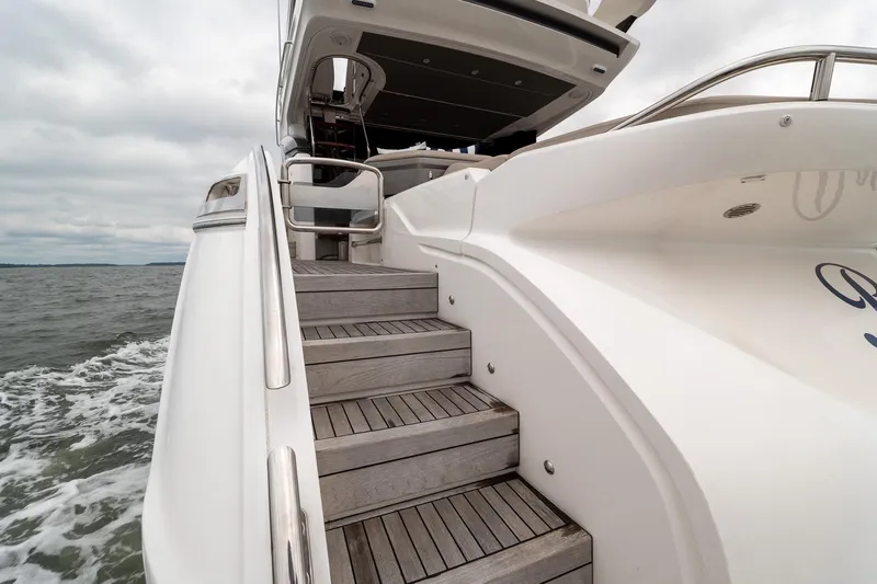 Regent Yacht Photos Pics Staircase on 2021 Princess S62 yacht, showcasing elegant design and ocean backdrop.