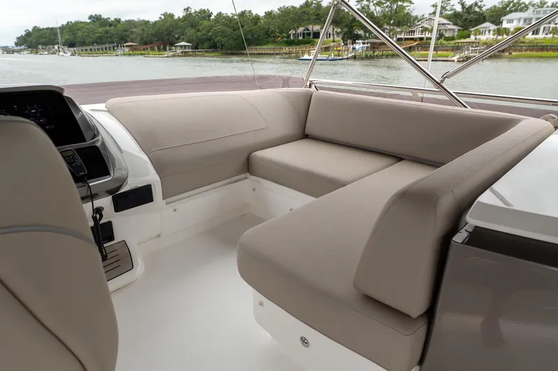 Regent Yacht Photos Pics Luxurious seating area on 2021 Princess S62 yacht, overlooking serene waterfront.