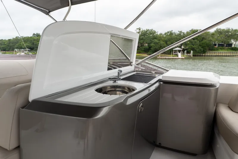 Regent Yacht Photos Pics Outdoor kitchenette on 2021 Princess S62 yacht with sink and storage.