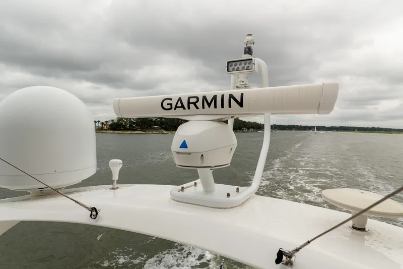 Regent Yacht Photos Pics Radar equipment on 2021 Princess S62 yacht, featuring Garmin technology, cruising on a cloudy day.