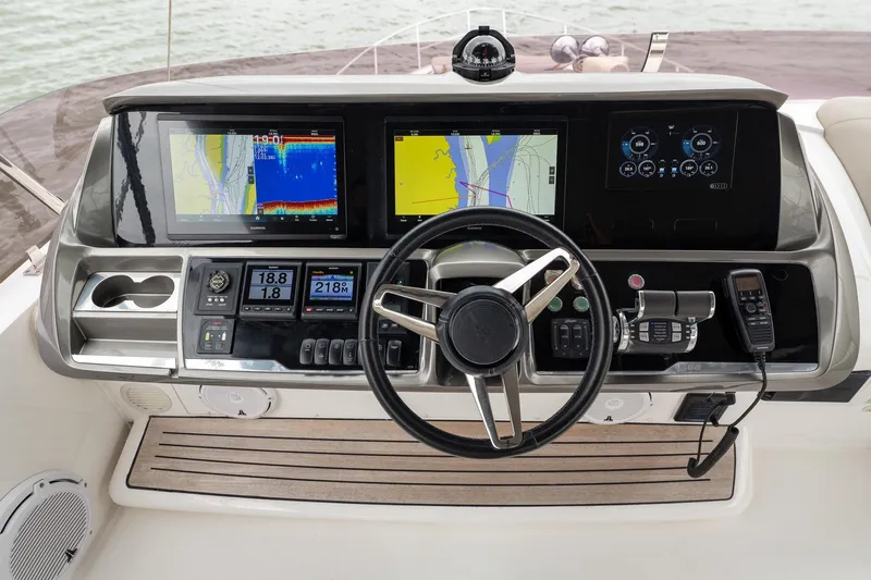 Regent Yacht Photos Pics Helm of 2021 Princess S62 yacht with advanced navigation displays and controls.
