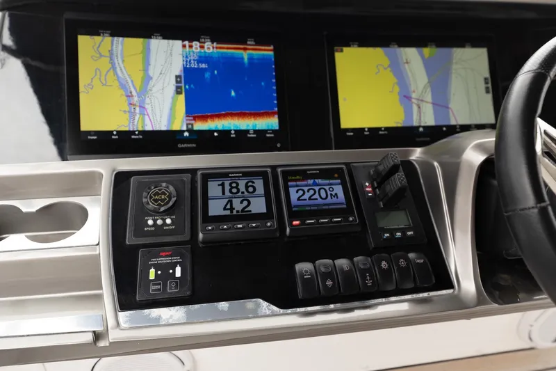 Regent Yacht Photos Pics Control panel of a 2021 Princess S62 yacht with navigation displays and controls.