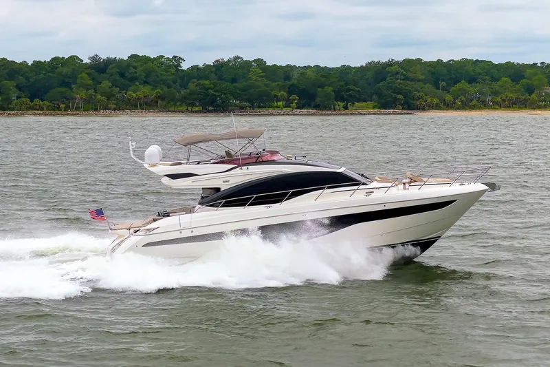 Regent Yacht Photos Pics Luxury 2021 Princess S62 yacht cruising on a scenic waterway.