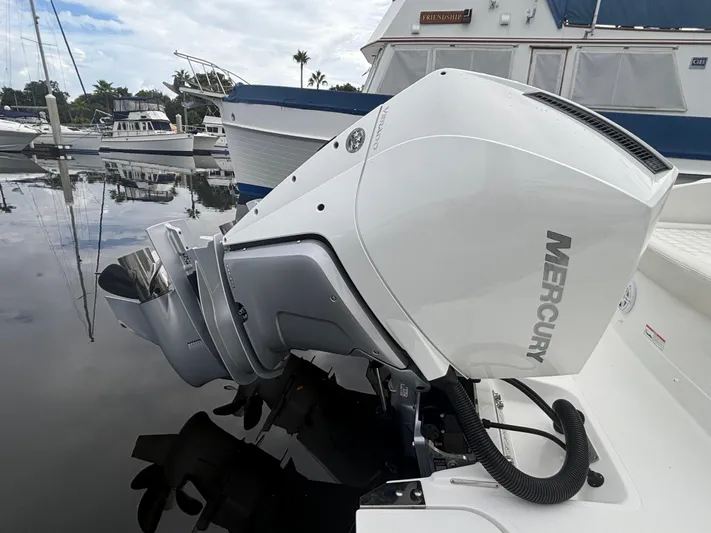  Yacht Photos Pics 2022 Cobalt 30SC with Mercury outboard engine at marina.