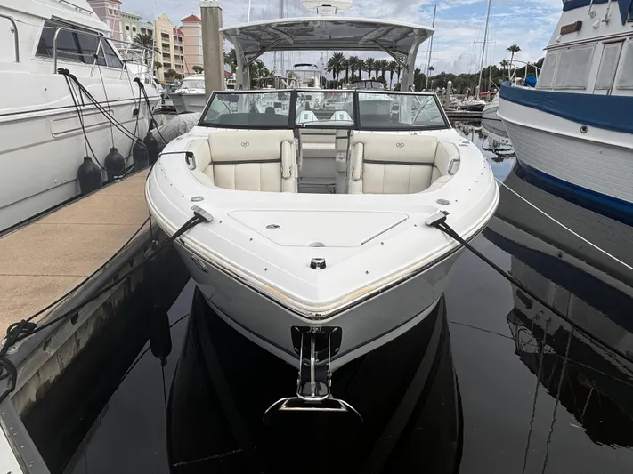  Yacht Photos Pics 2022 Cobalt 30SC boat docked at marina, surrounded by other vessels.