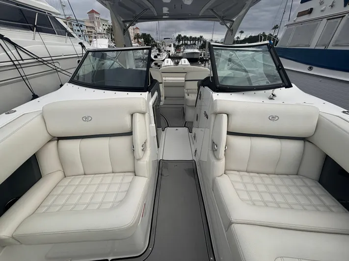  Yacht Photos Pics 2022 Cobalt 30SC boat interior with white leather seating and modern design.