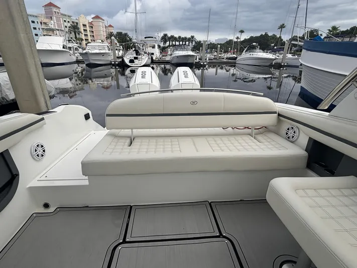  Yacht Photos Pics 2022 Cobalt 30SC boat interior with white seating at marina.
