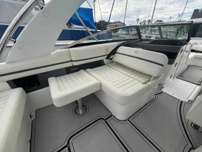  Yacht Photos Pics 2022 Cobalt 30SC boat interior with luxurious white seating and modern design.